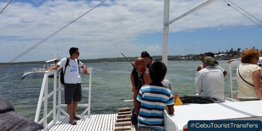 people on boat headed to malapascua