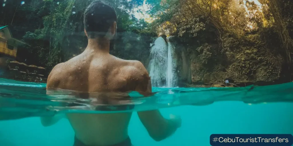 Man enjoying Kawasan Falls in South Cebu